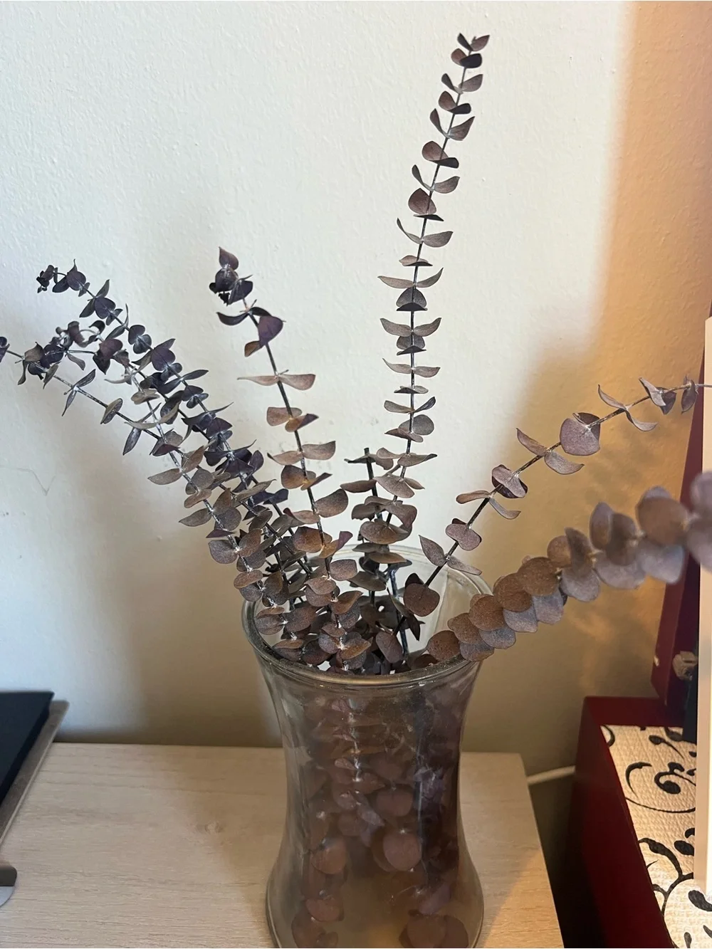 Dried Eucalyptus Stem Arrangement in Brown Glass Vase